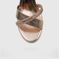 Bulbul Ladies Evening Slingback Sandal in champagne metallic with rhinestone embellished criss-cross straps. Front view.