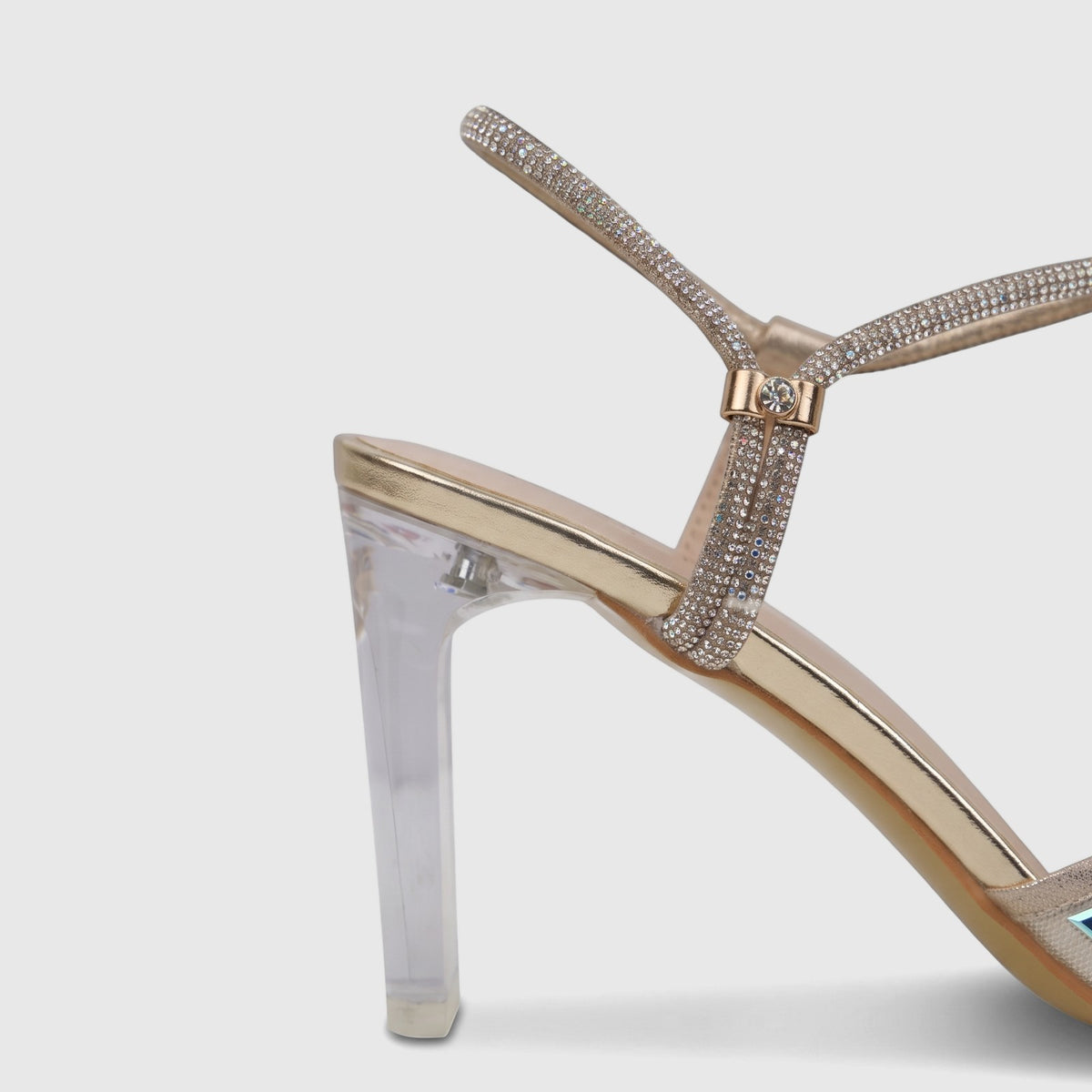 A single Bulbul Ladies Evening Slingback Sandal in gold, featuring sparkling rhinestone-encrusted straps and a clear block