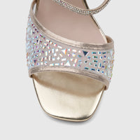 Close-up of a Bulbul Ladies Evening Slingback Sandal in gold, featuring iridescent rhinestone embellishments on the front