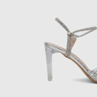 Close-up side view of a Bulbul Ladies Evening Slingback Sandal in silver, featuring shimmering rhinestone-embellished straps