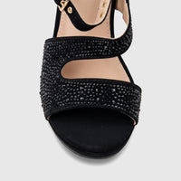 Close-up of a black Bulbul ladies' evening wedge sandal with sparkling rhinestone-embellished straps and a black matte sole.
