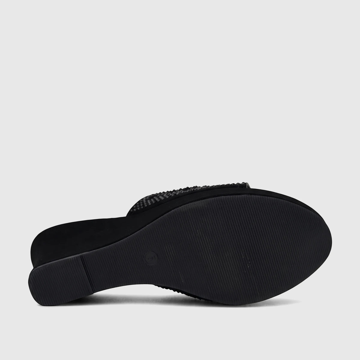 Bulbul Ladies Evening Wedge Sandal in black, displaying the textured sole and embellished upper strap from a low angle.
