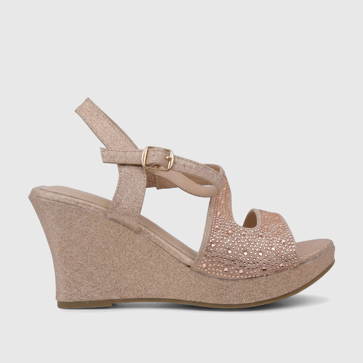 Bulbul Ladies Evening Wedge Sandal in sparkling champagne glitter, featuring a sturdy wedge heel and adjustable ankle strap.