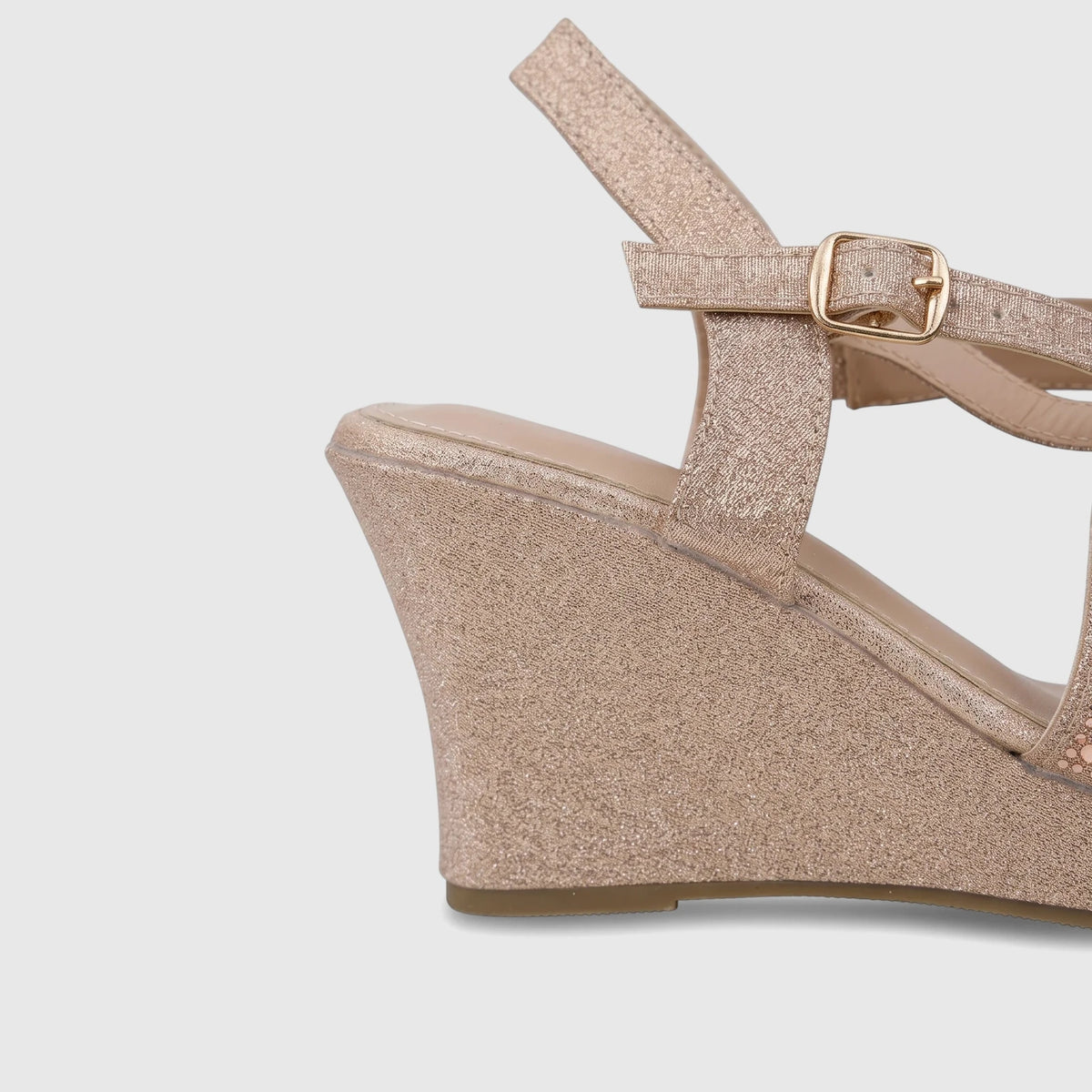 Bulbul Ladies Evening Wedge Sandal in champagne glitter with rhinestone details, side view.