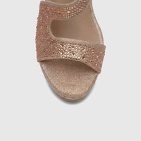Close-up of a sparkling rose gold Bulbul Ladies Evening Wedge Sandal, adorned with numerous rhinestones.