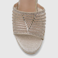 Close-up of a sparkling light gold Bulbul Ladies Evening Wedge Sandal with rhinestone-embellished straps and a glitter