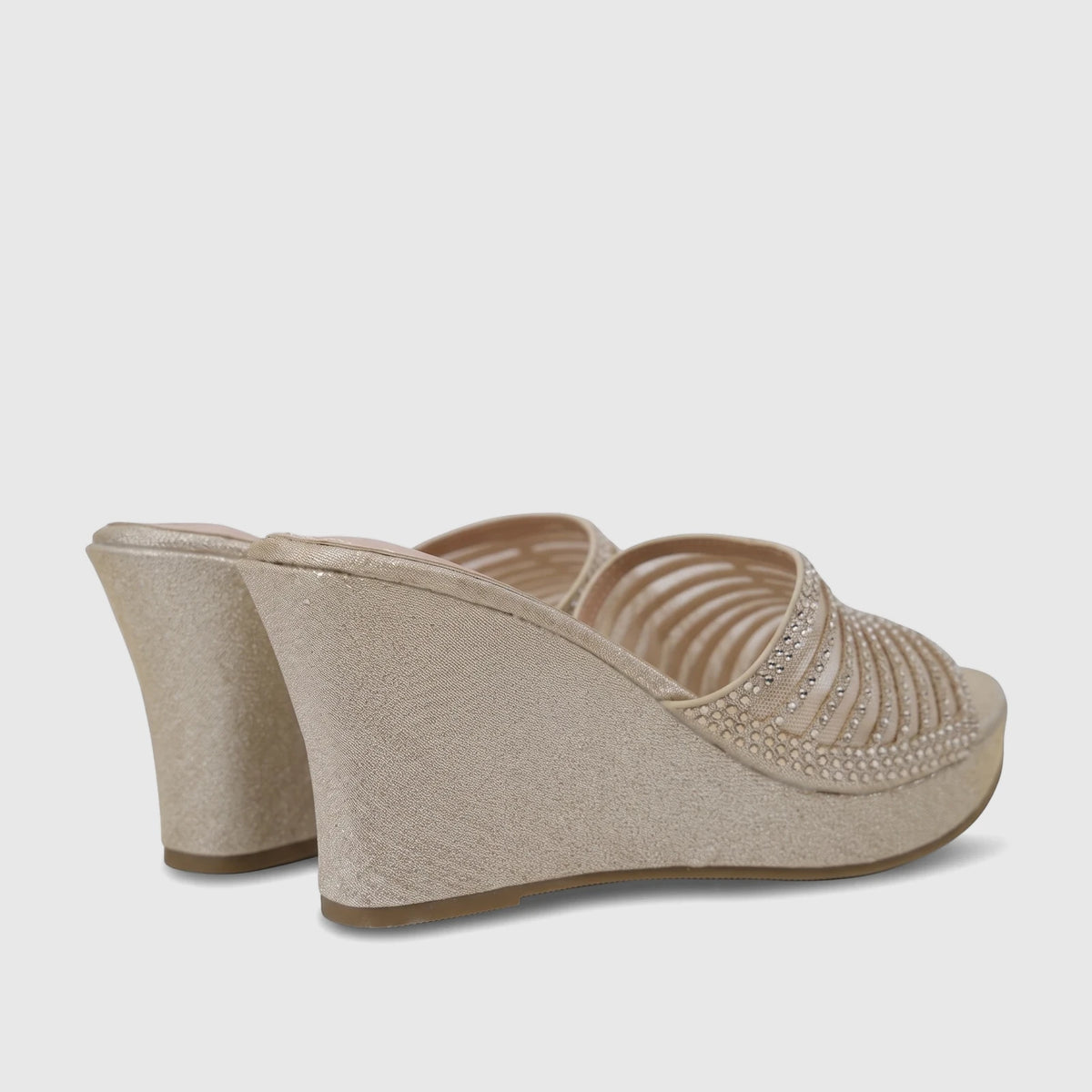 Pair of light gold Bulbul Ladies Evening Wedge Sandals, featuring a glitter finish and rhinestone-embellished straps, seen