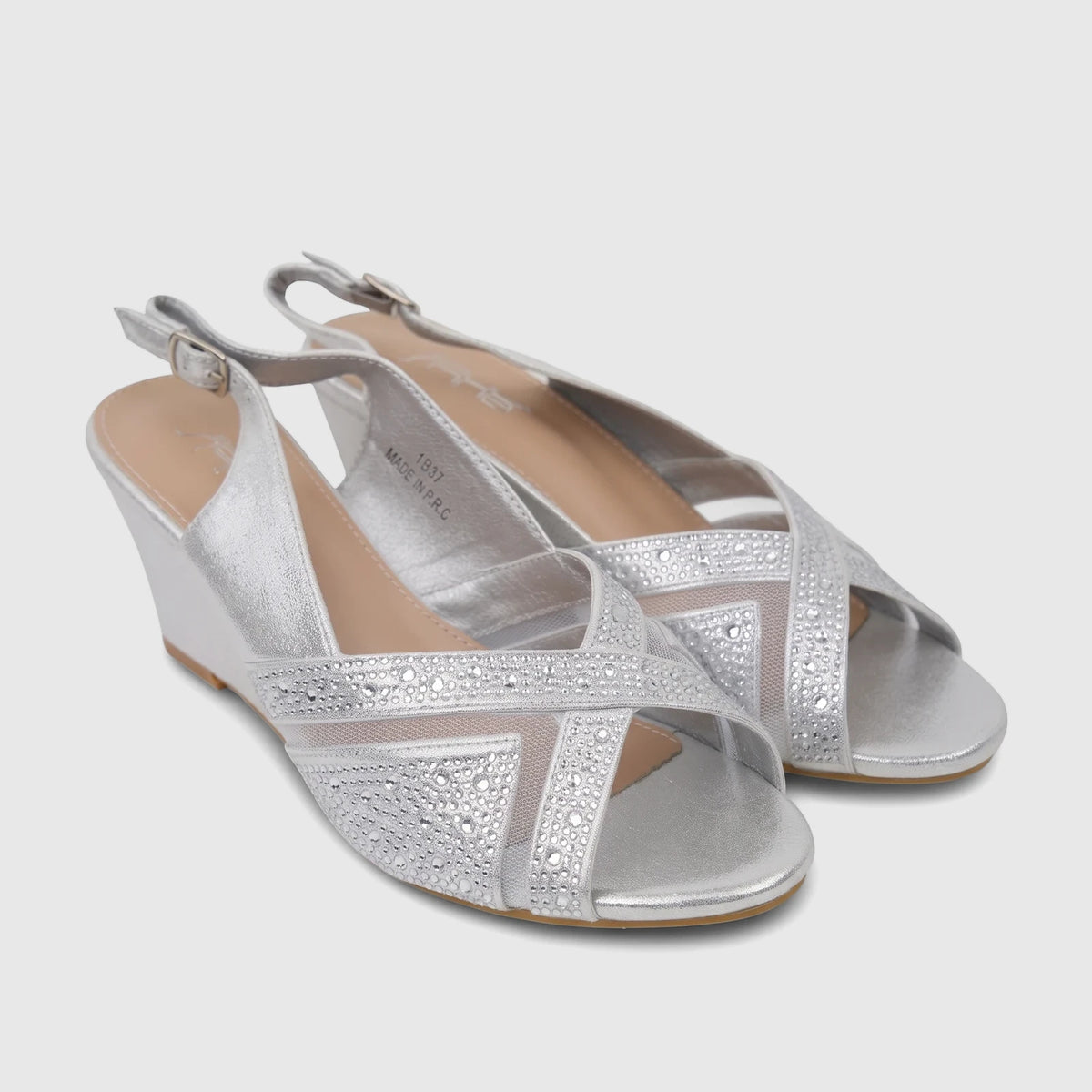 Pair of Bulbul Ladies Evening Wedge Sandals in silver, featuring a wedge heel, open-toe, and rhinestone-embellished mesh