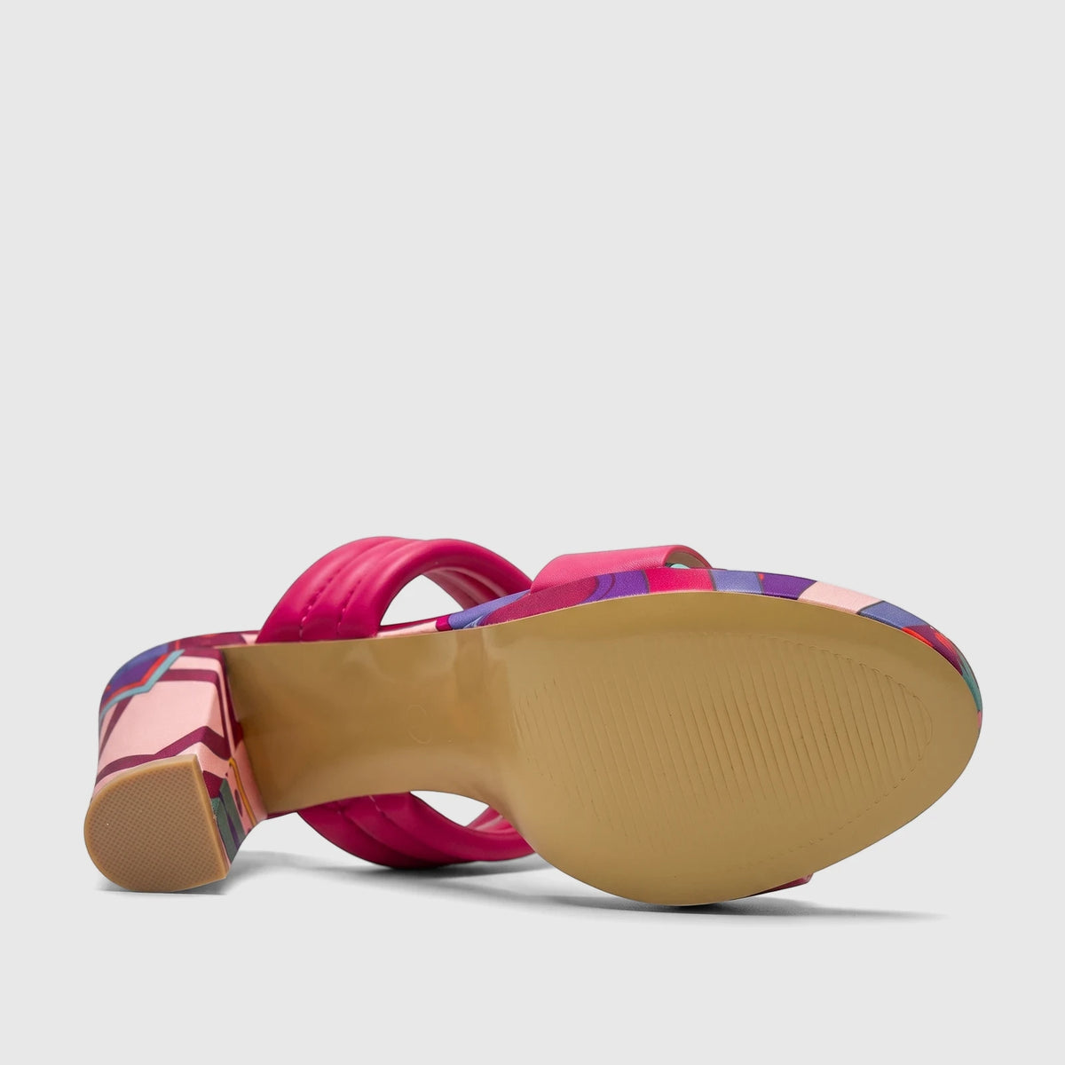 Fuchsia pink padded double strap block heel mule with a colorful patterned heel and tan sole.