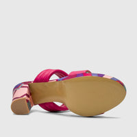 Fuchsia pink padded double strap block heel mule with a colorful patterned heel and tan sole.