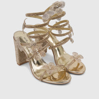 Bulbul Ladies Gold Spiral Strap Evening Heel Sandals featuring rhinestone embellishments and a chunky block heel.