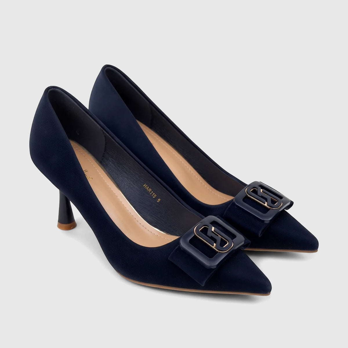 Pair of navy blue Bulbul Ladies Dress Court Shoes with pointed toes and decorative buckle detail on an off-white background.