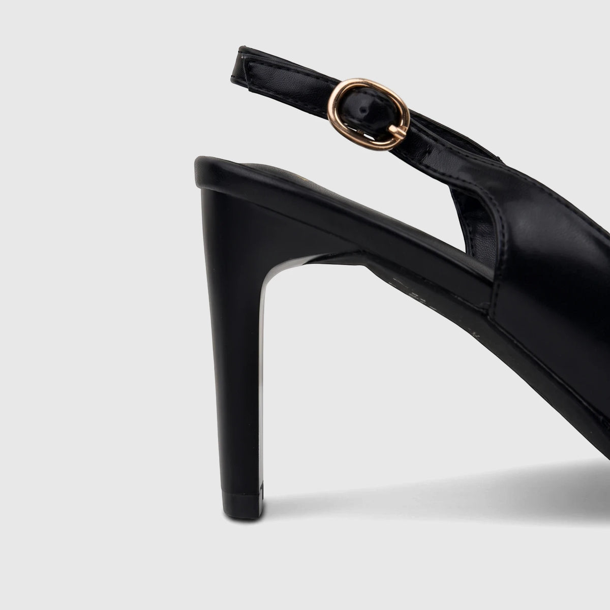 Close-up of a black Bulbul slingback peep toe sandal with a high heel and golden buckle.