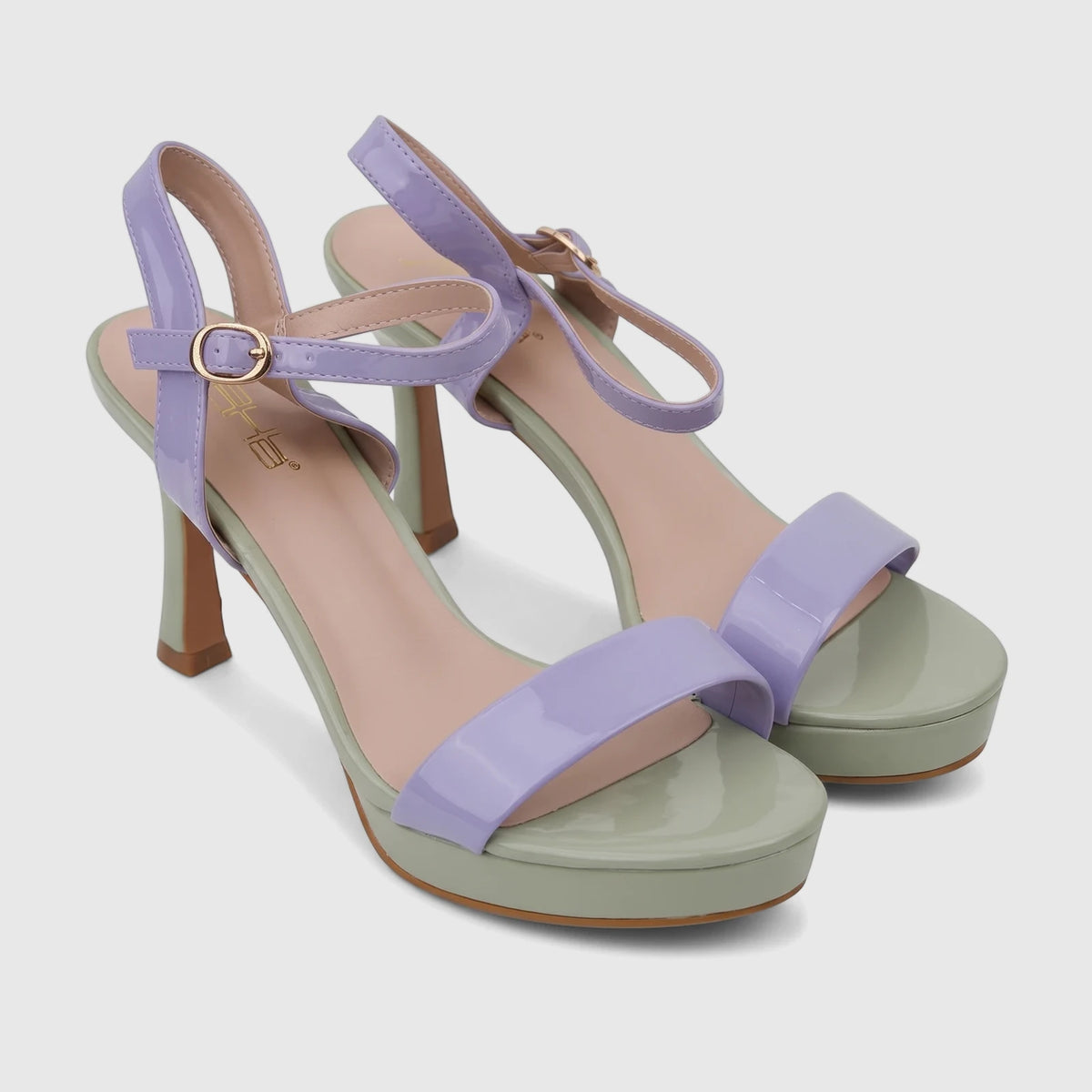 A pair of Bulbul ladies casual slingback sandals featuring light purple patent straps and light green platforms and heels.