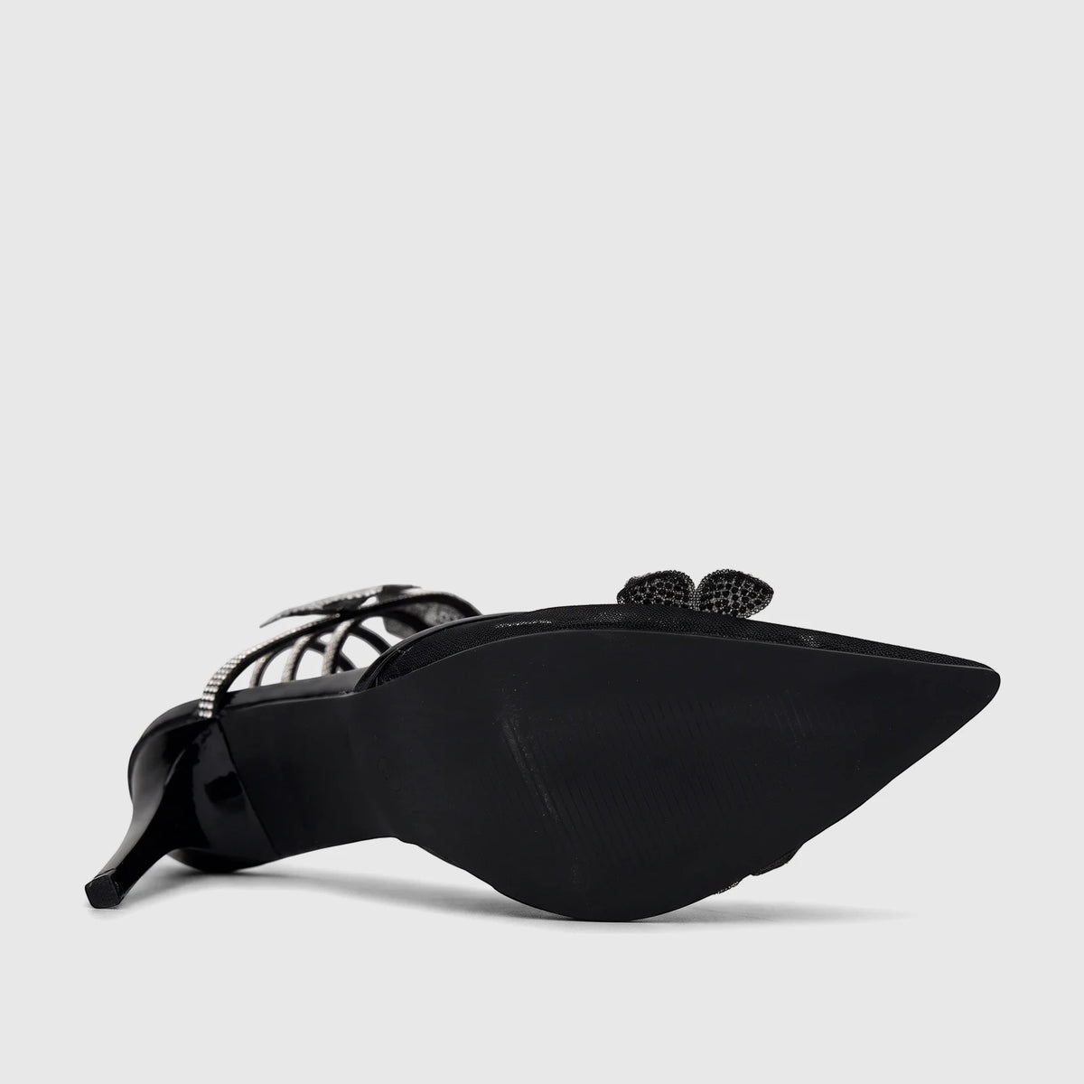 Black Bulbul Ladies Spiral Strap Evening Heel Sandal with a pointed toe and rhinestone detailing, viewed from the side.