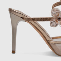 Close-up of a Bulbul Ladies Spiral Strap Evening Heel Sandal in rose gold, featuring rhinestone flower embellishments and a