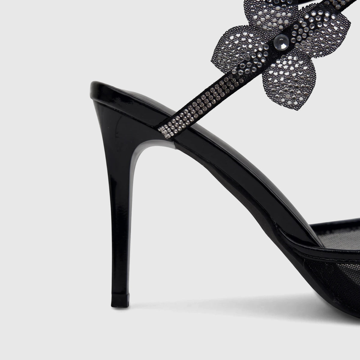Black patent leather spiral strap evening high heel sandal for ladies, featuring intricate rhinestone embellishments.
