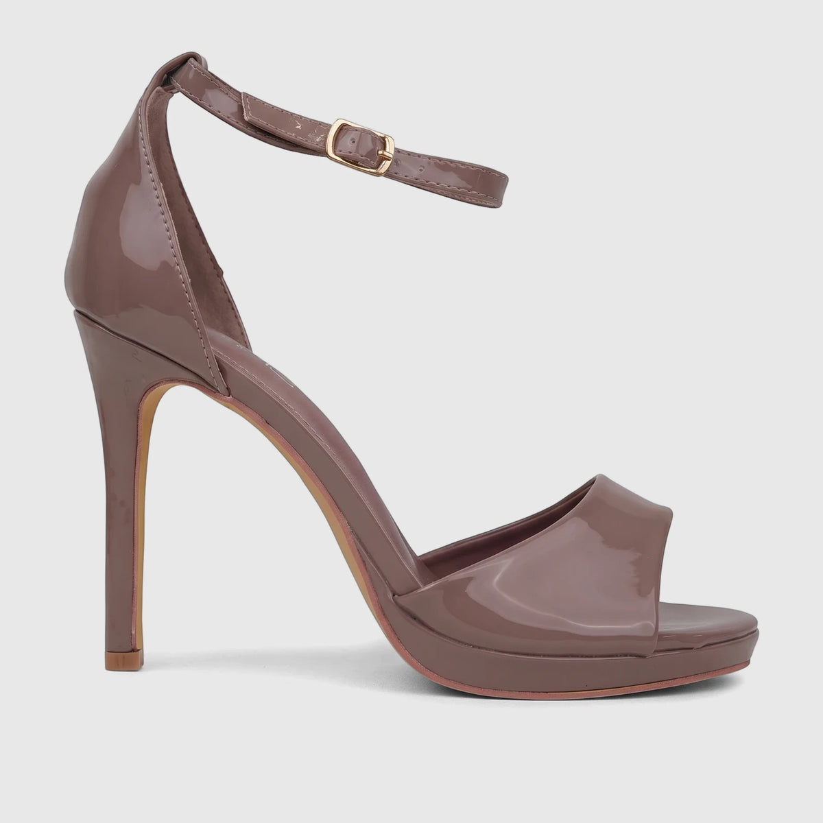 Bulbul Ladies Stiletto Heel Sandal in mocha patent leather, featuring an open toe and an ankle strap with a gold buckle,