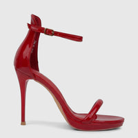 Red patent leather stiletto heel sandal for ladies with ankle strap and gold buckle, shown from a side view.