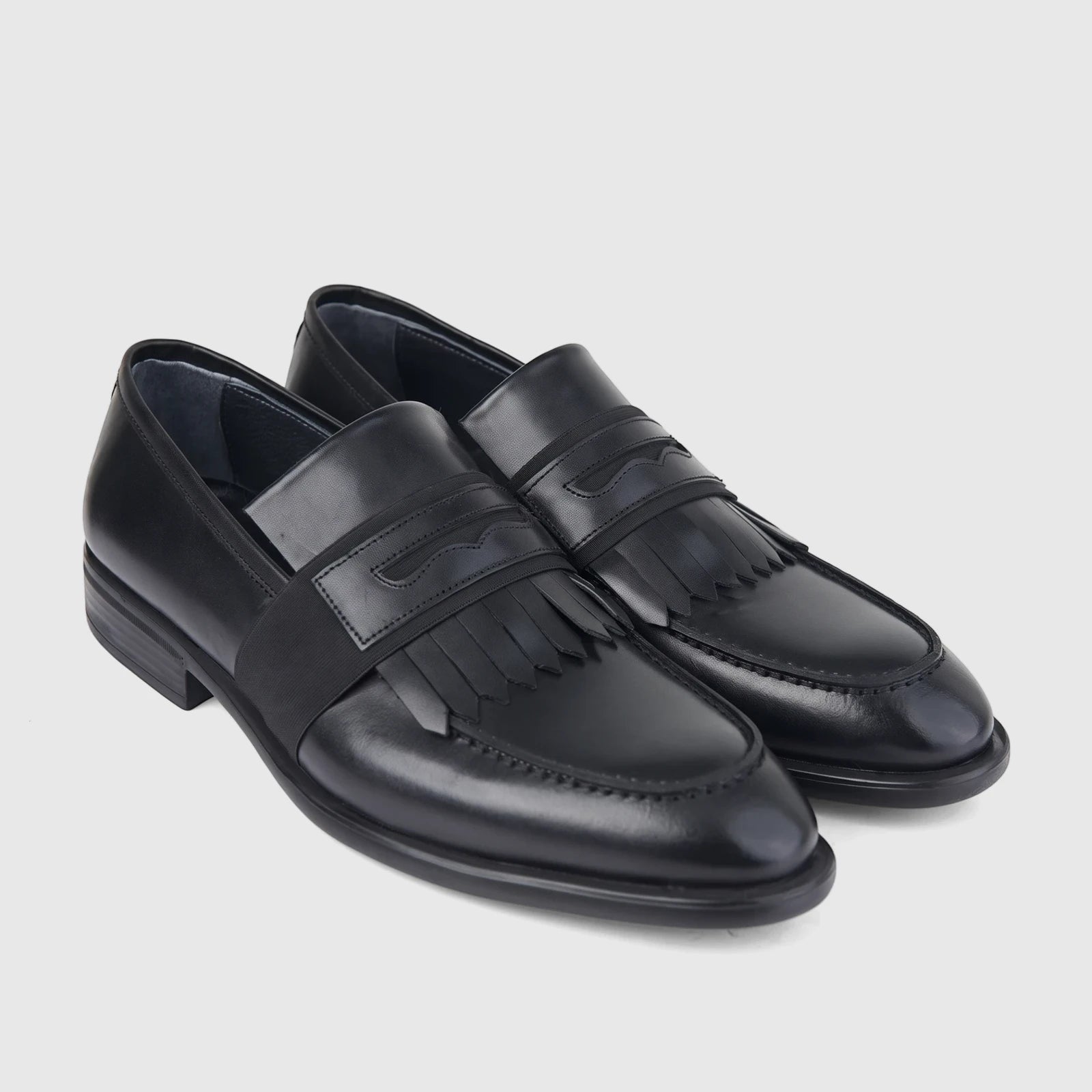 Bulletti men's black leather dress slip-on shoes with fringe detail on a plain background, angled view.