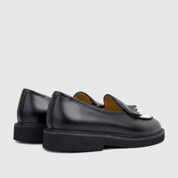 Two Bulletti men's black and white leather chunky sole loafers, B7813M Crosswind, viewed from a rear-side perspective.