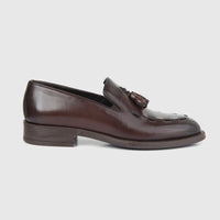 Bulletti men's brown leather dress slip-on loafer with tassel, side view showing stitched apron toe.