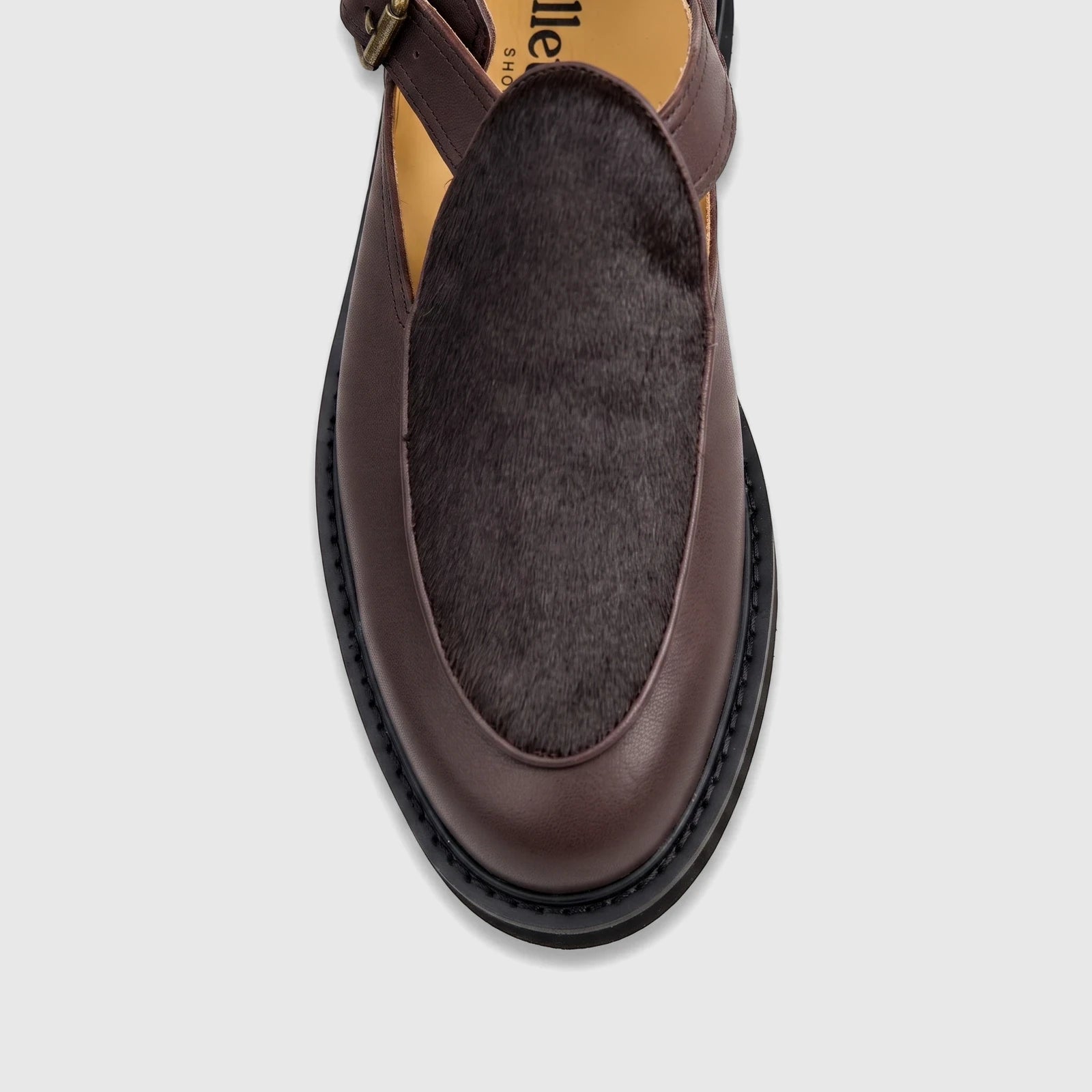 Men's Bulletti chunky sole sandal in stallion brown leather with dark fur detail, viewed from a top-down angle.
