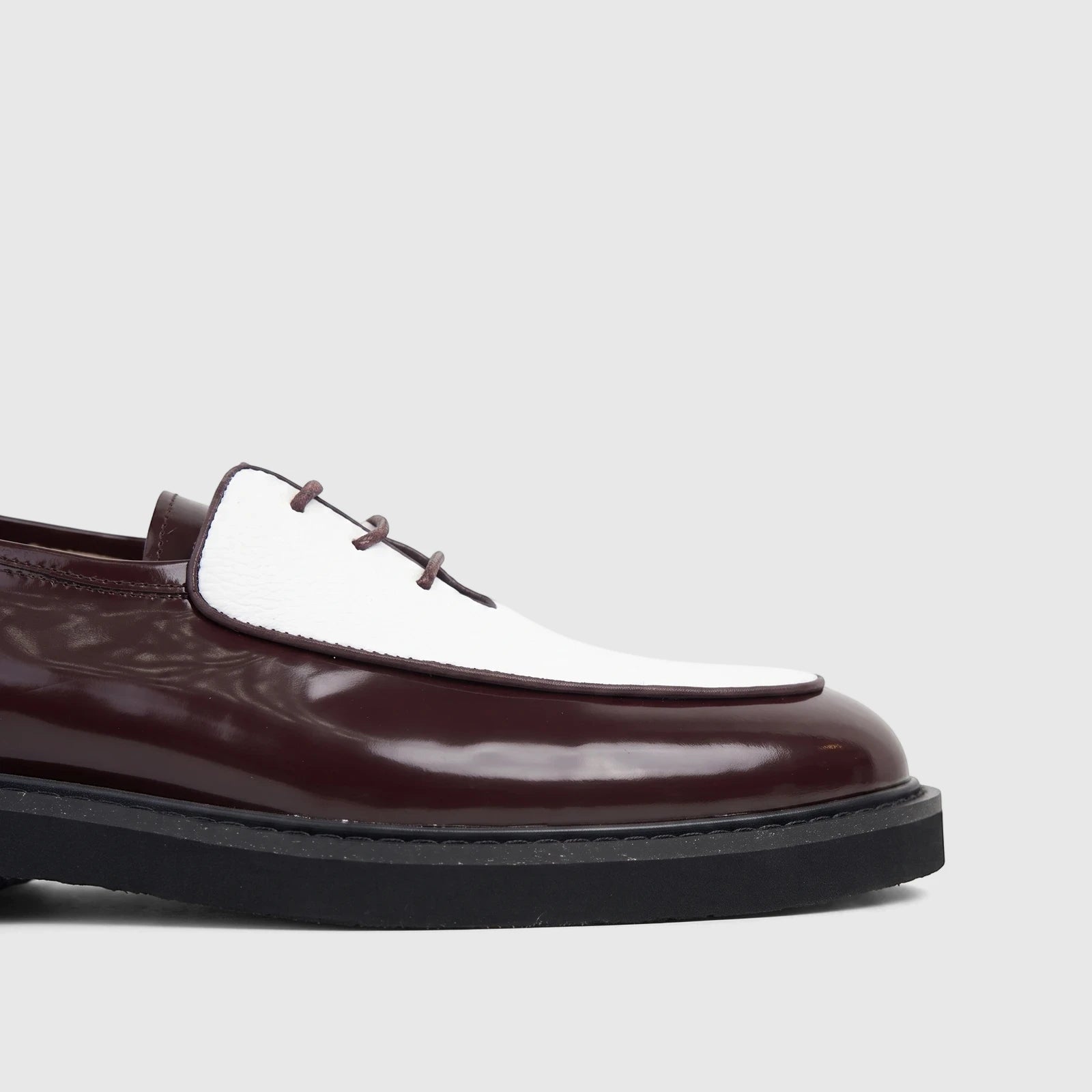 Bulletti Men's Leather Chunky Sole Lace Up Odyssey shoe in burgundy polished leather and white, showcasing the side view.