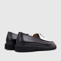 Bulletti Men's black and white leather lace-up shoes with chunky soles, shown from a side-rear angle.