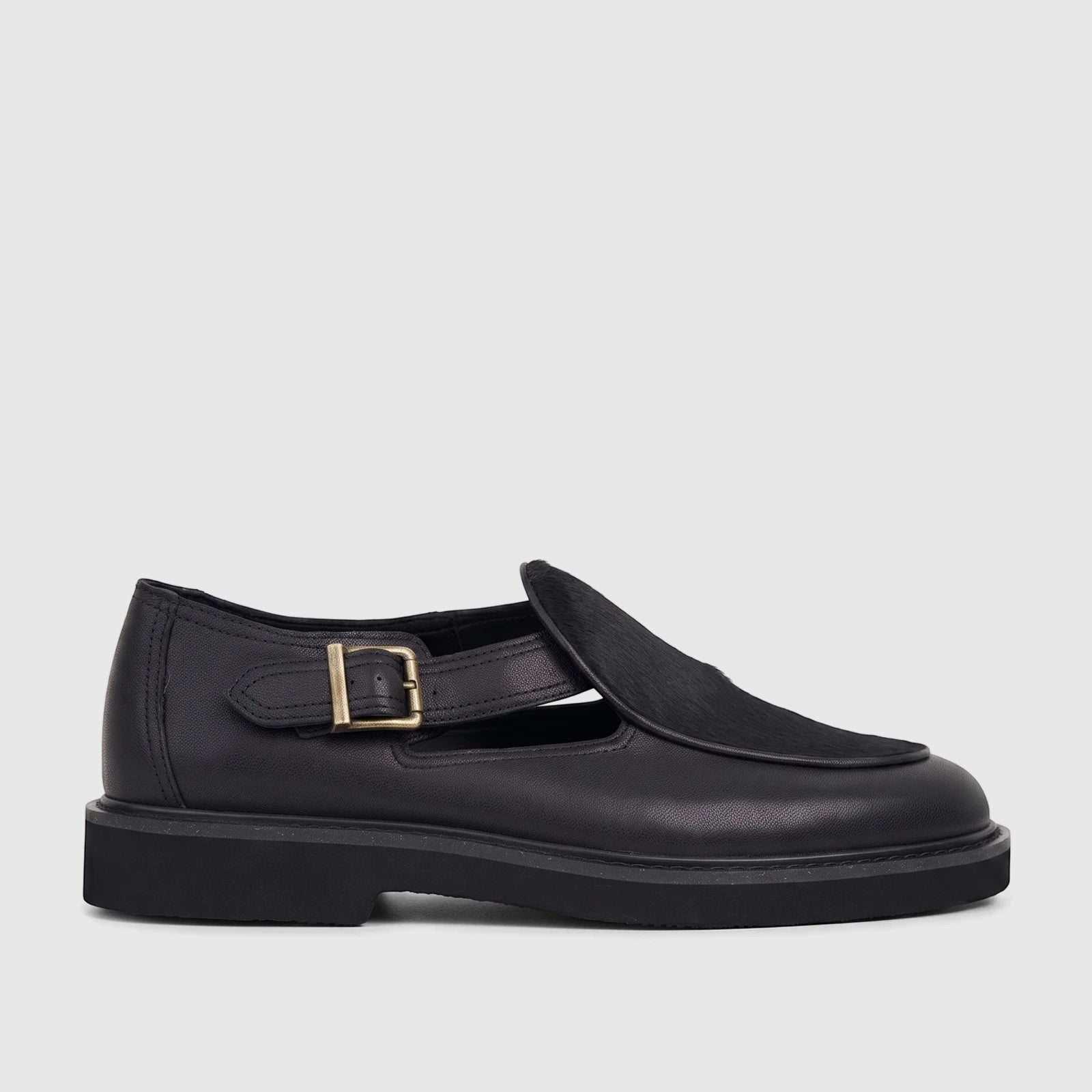 Bulletti Men's B7814M Stallion Black leather chunky sole sandal with a gold buckle strap and pony hair detail on the vamp.