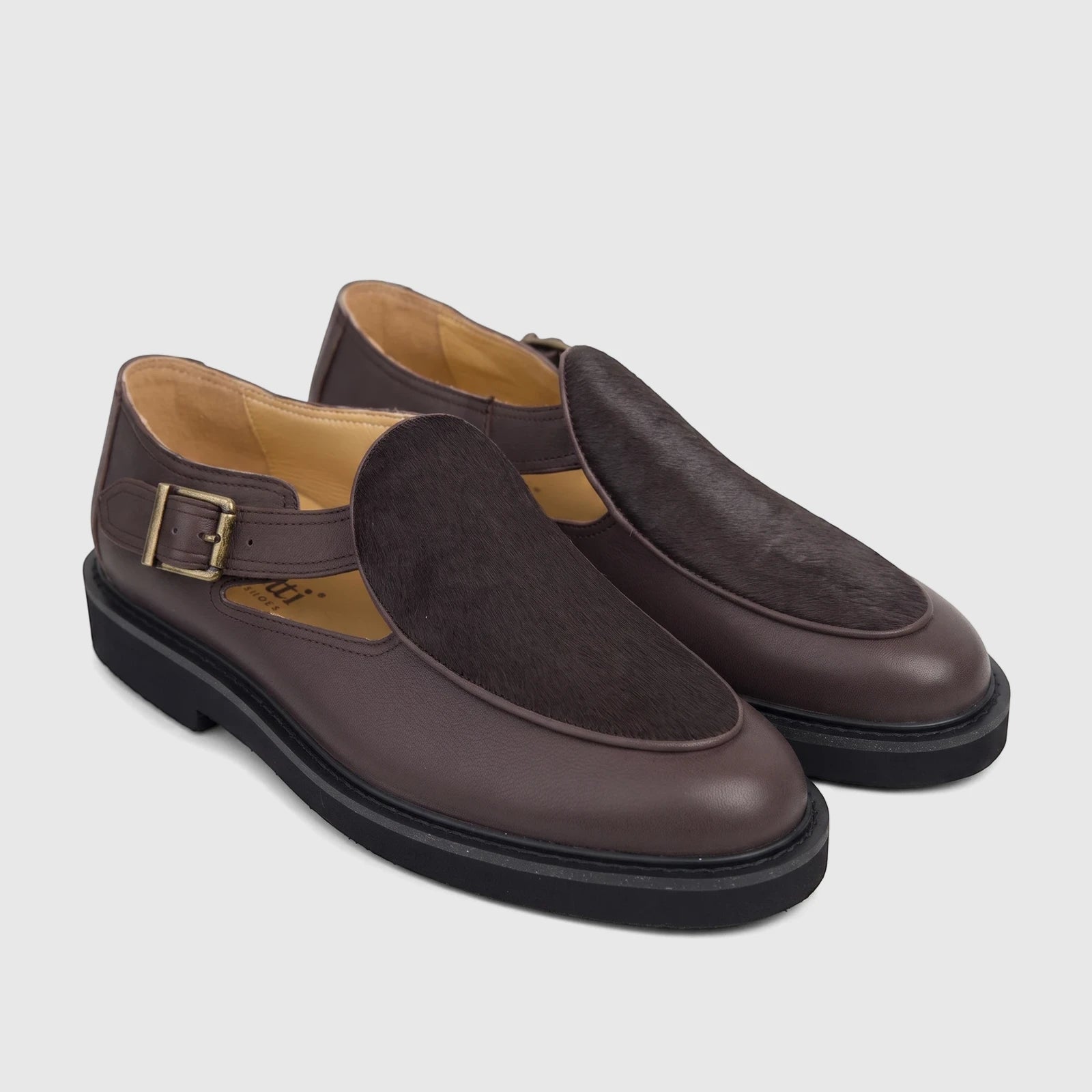 Pair of Bulletti Men's Leather Chunky Sole Sandals B7815M in Stallion Brown, with fur-like vamp and buckle strap.