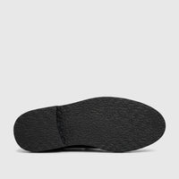 Black chunky sole of a Bulletti Men's Leather Lace Up shoe, showcasing its textured grip and durable design.