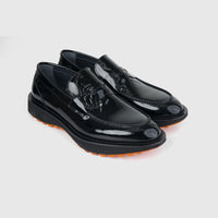 Bulletti Men's Leather Chunky Sole Slip On 96-553 loafers in black patent leather with thick lug sole, angled view