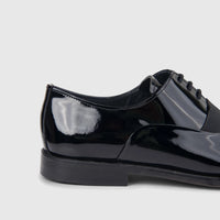 Bulletti Men's Leather Dress Lace Up shoe in black patent leather, captured in a close-up side view.