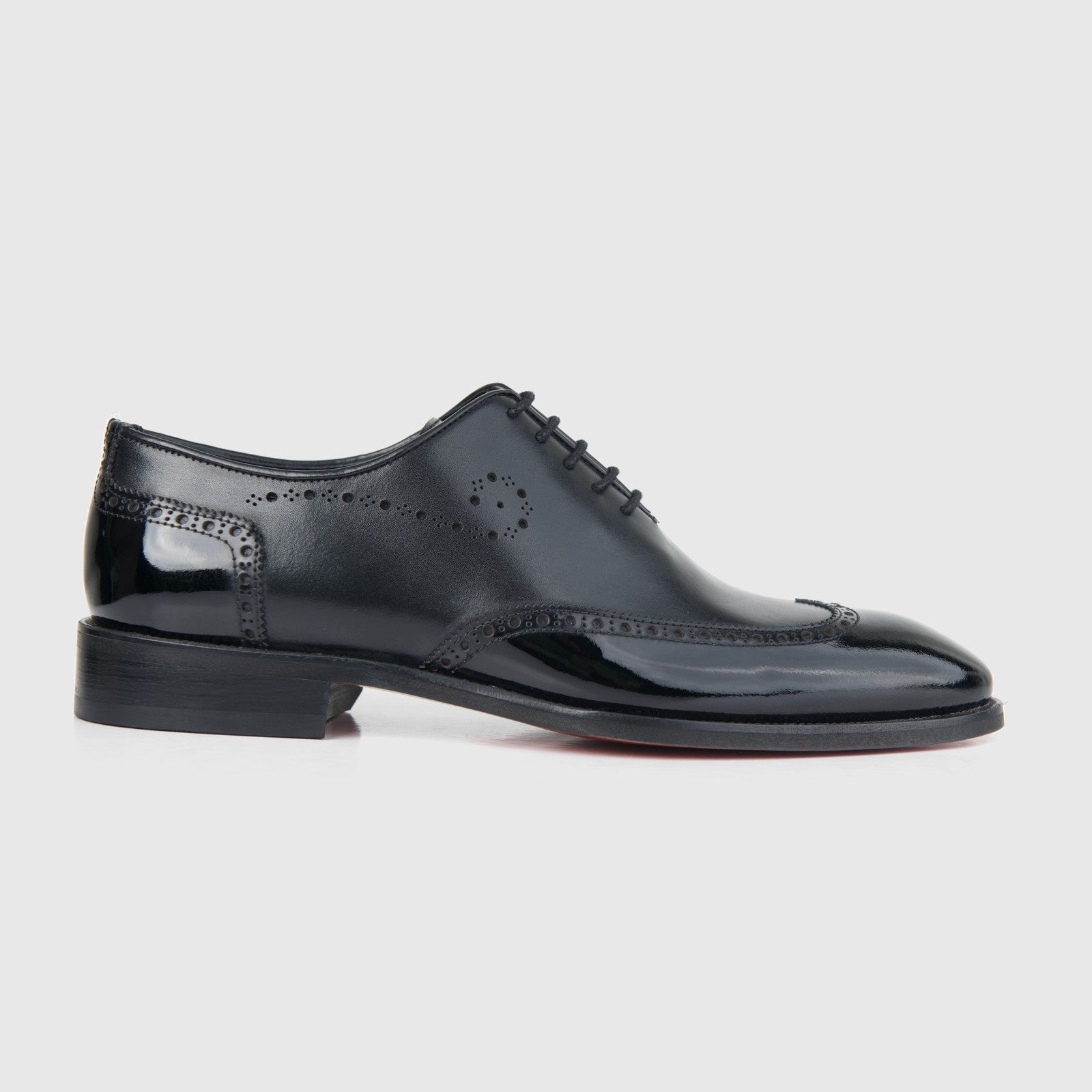 Bulletti men's black leather dress lace-up brogue shoe, side view with glossy finish and perforated detailing.