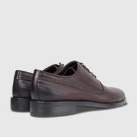 Bulletti Men's Leather Dress Lace Up shoes in brown, featuring a distinct wavy texture and braided trim, viewed from the