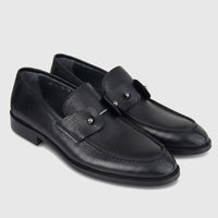 Bulletti Men's Leather Dress Slip On 140-48 in black pebbled leather, pair of loafer shoes shown angled view.