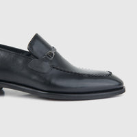 Bulletti men's leather dress slip-on 5-54 in black, side view showing moc-toe stitching and low heel.