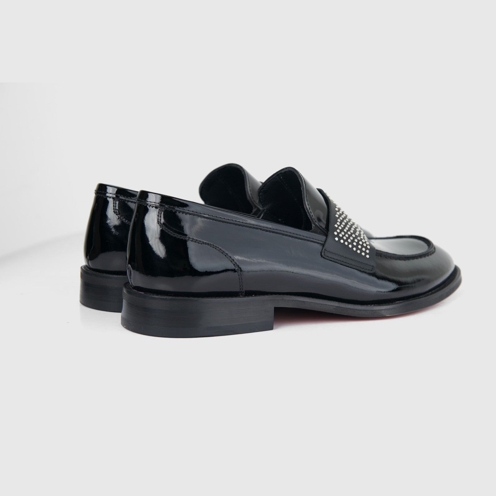 Bulletti men's leather dress slip-on with studs, black patent finish loafer shown from side and back.