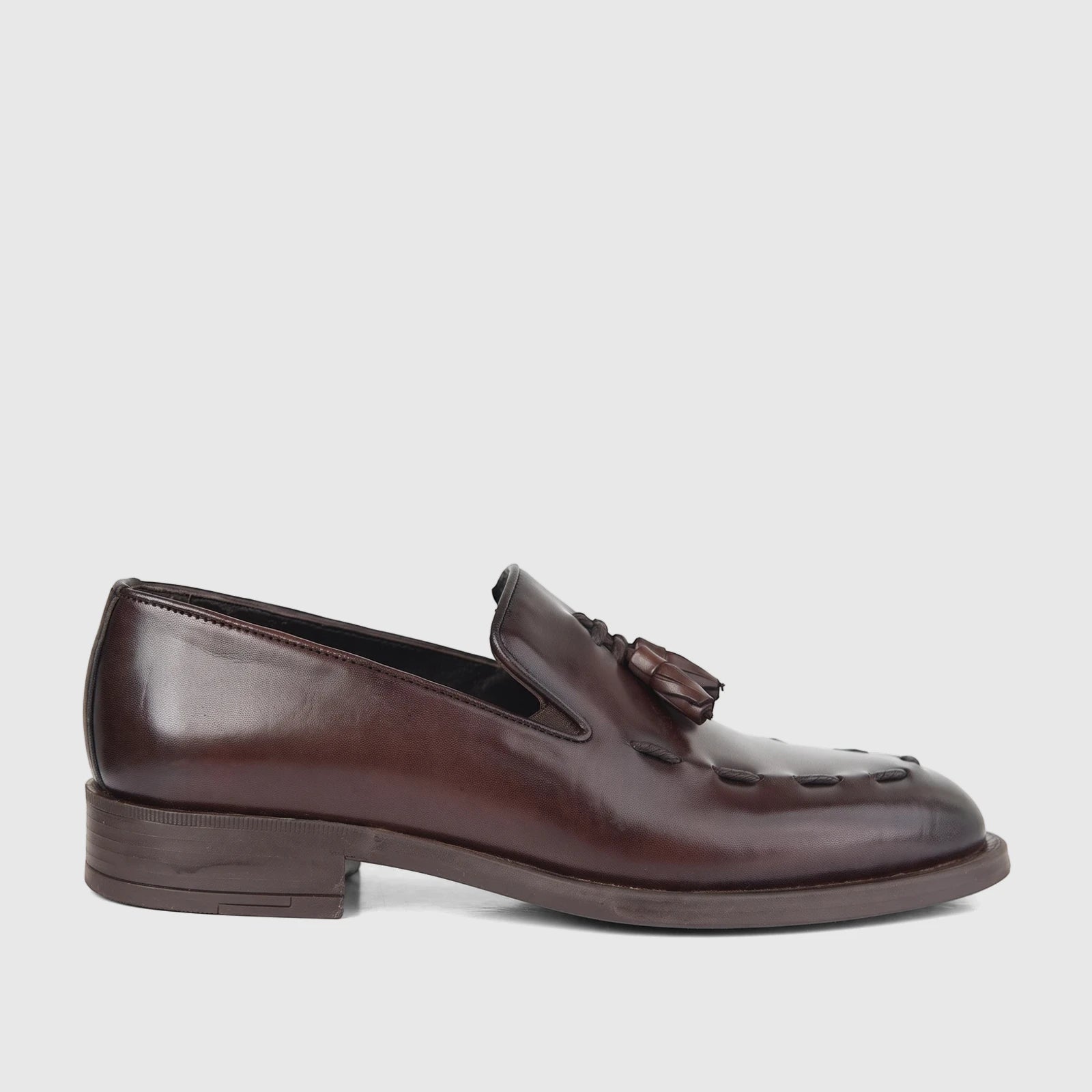 Bulletti Men's Leather Dress Slip On with Tassel 96-378 Brown BC80. A close-up side view of a rich brown leather slip-on