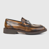 Bulletti men's leather chunky sole slip on loafer in tan, side view showing metal bit detail and moc toe stitching.