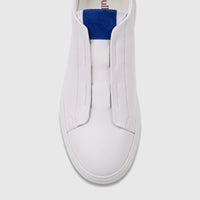 Top-down view of a Bulletti Men's Leather Sneaker. White slip-on design with a blue accent, featuring smooth leather and