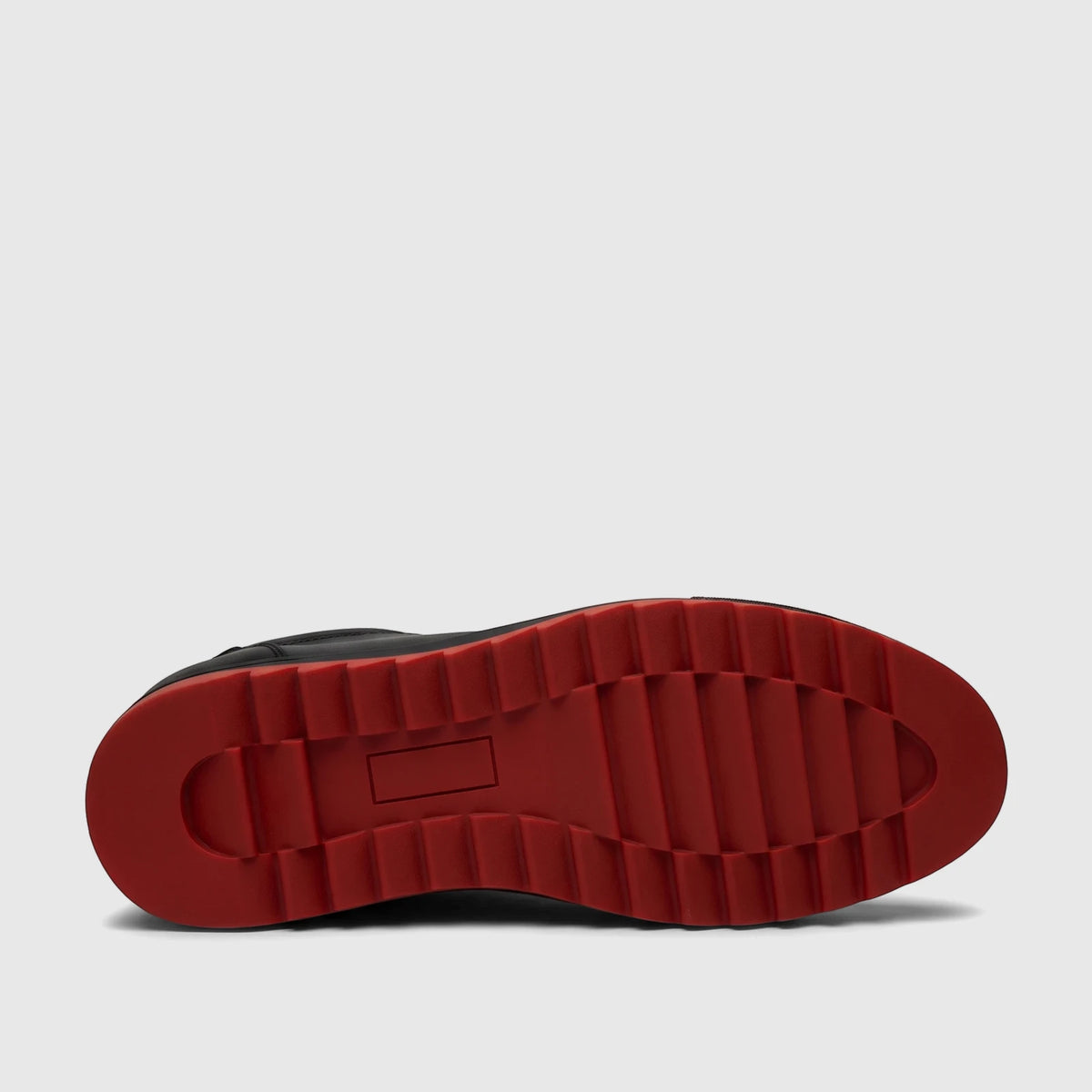 Underside view of a Bulletti Men's Leather Sneaker Black HASM-001, featuring a bright red rubber sole with a prominent