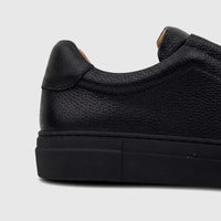 Close-up side view of a Bulletti Men's Leather Sneaker Black HASM-006, highlighting its pebbled texture and stitching
