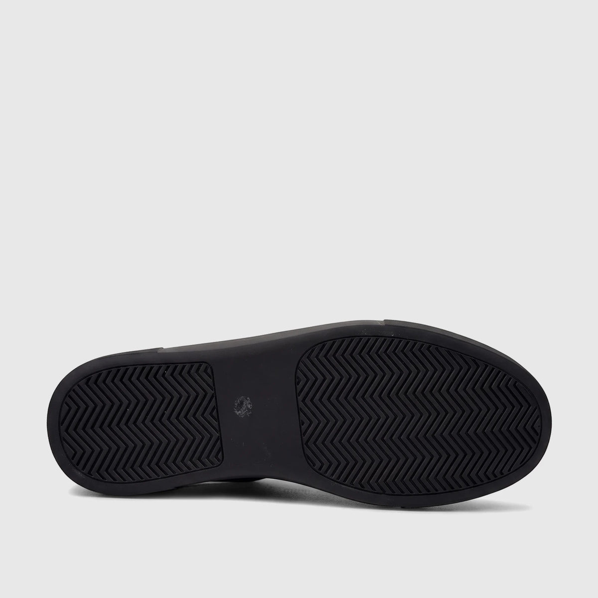 View of the black sole of a Bulletti Men's Leather Sneaker, showcasing its distinctive chevron tread pattern.
