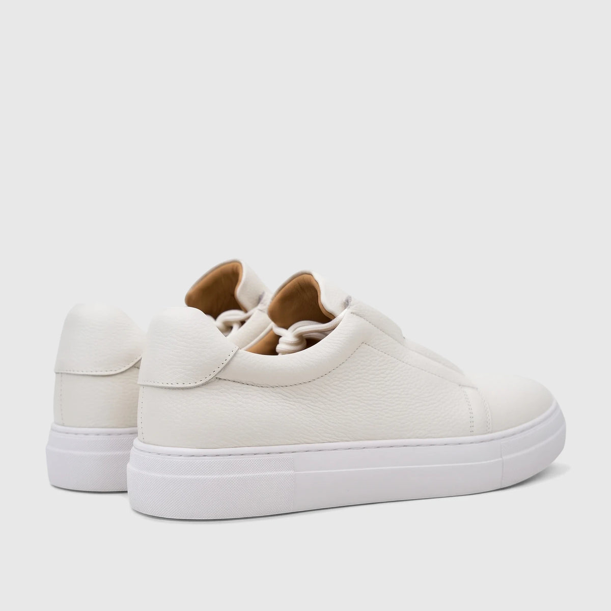 Pair of Bulletti Men's Leather Sneaker White HASM-006, featuring a pebbled texture and thick white soles, viewed from the