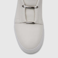Close-up of a white Bulletti men's leather sneaker with silver metallic hardware detail on the vamp.