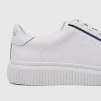 White Bulletti men's leather sneaker with white laces and a textured sole, shown in a side profile.