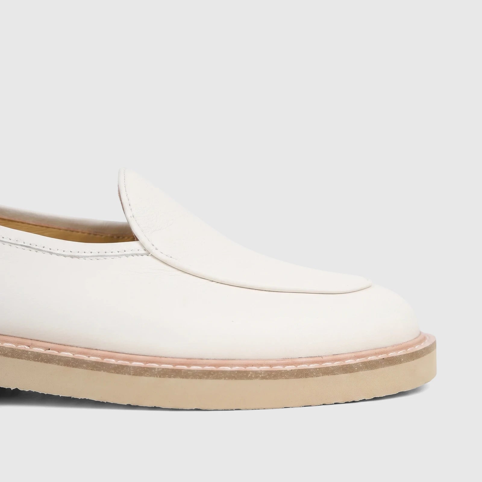 Close-up side view of a Bulletti Men's Off White Leather Chunky Sole Loafer B7812M with a beige chunky sole.