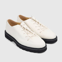 A pair of Bulletti Men's Seawolf Off White leather casual lace-up shoes with chunky black soles, viewed from a slightly